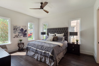 Large transitional master dark wood floor and brown floor bedroom photo in Orlando with white walls