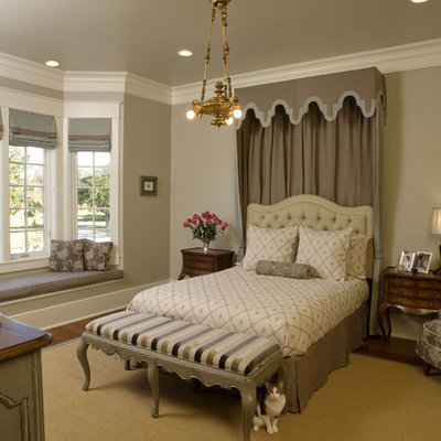 Inspiration for a large timeless master dark wood floor bedroom remodel in New Orleans with beige walls and no fireplace