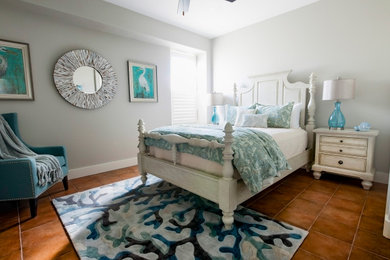 Mid-sized beach style guest bedroom photo in Other with gray walls