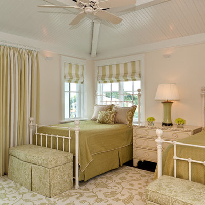 Example of an island style bedroom design in Miami with beige walls