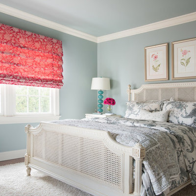 Bedroom - mid-sized traditional guest dark wood floor and brown floor bedroom idea in New York with blue walls