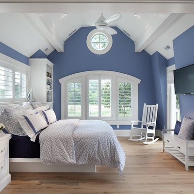 Bedroom - large coastal master light wood floor bedroom idea in DC Metro with blue walls and no fireplace
