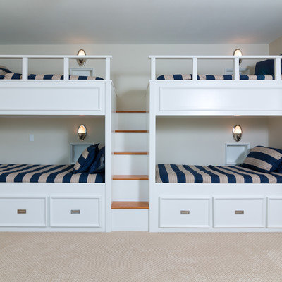 Inspiration for a large coastal guest carpeted bedroom remodel in Birmingham with beige walls and no fireplace