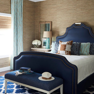 Inspiration for a mid-sized coastal dark wood floor and brown floor bedroom remodel in Atlanta with beige walls