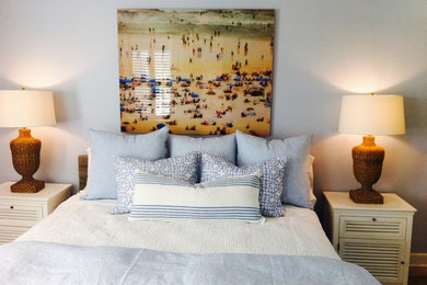 Example of a mid-sized beach style master light wood floor bedroom design in Toronto with blue walls