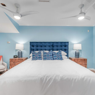 Diseño de dormitorio marinero con paredes azules y suelo rojo