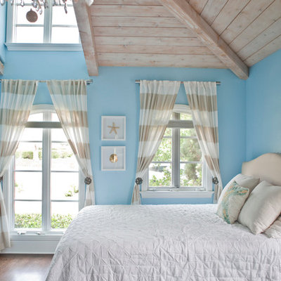 Large beach style guest bedroom photo in San Diego with blue walls
