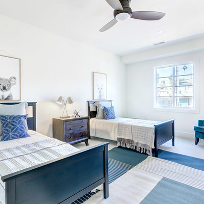 Inspiration for a coastal guest carpeted and gray floor bedroom remodel in San Diego with white walls
