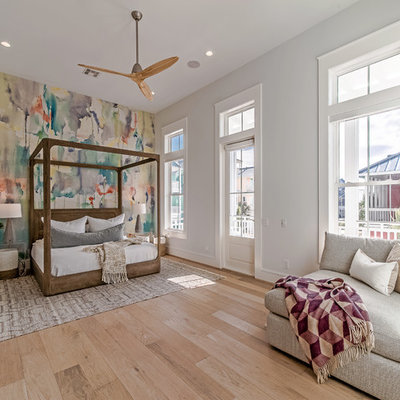 Beach style light wood floor bedroom photo in Houston with multicolored walls