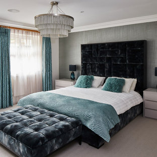 Contemporary bedroom in Kent with white walls, carpet and beige floors.