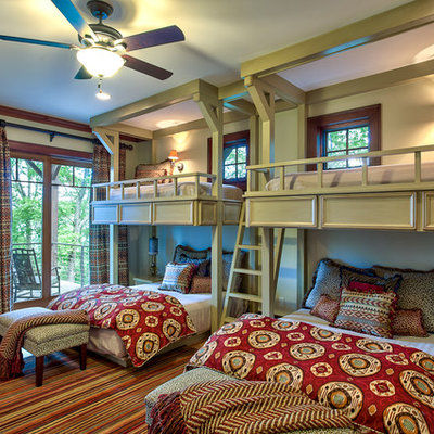 Inspiration for a timeless medium tone wood floor bedroom remodel in Other with green walls