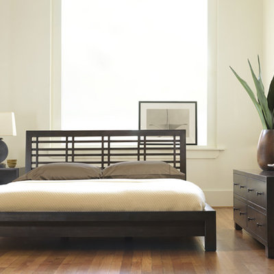 Bedroom - contemporary medium tone wood floor bedroom idea in Philadelphia with white walls and no fireplace