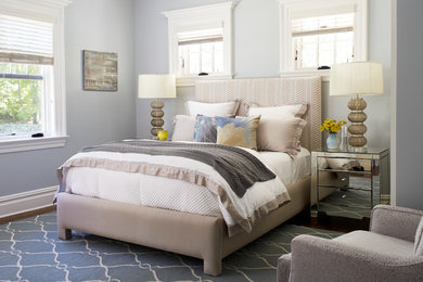 Inspiration for a large transitional guest dark wood floor bedroom remodel in New York with white walls