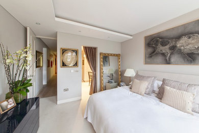 Inspiration for a medium sized contemporary master bedroom in London with grey walls and carpet.