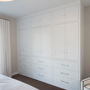 Inspiration for a mid-sized modern guest carpeted bedroom remodel in New York with white walls