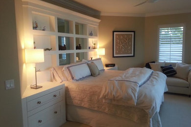 Inspiration for a mid-sized contemporary master bedroom remodel in Miami with beige walls