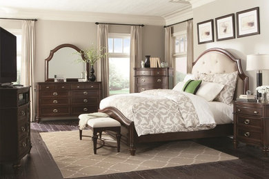 Inspiration for a dark wood floor bedroom remodel in Orlando with beige walls