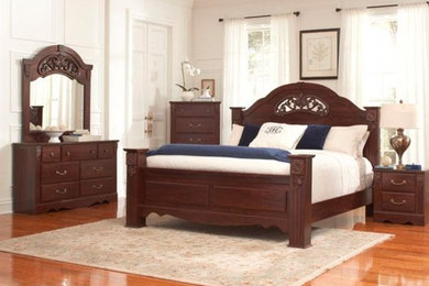 Inspiration for a medium sized master bedroom in Jackson with white walls and light hardwood flooring.