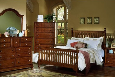Example of a mid-sized classic master dark wood floor bedroom design in Columbus with beige walls