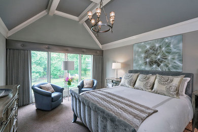 Inspiration for a large transitional master carpeted bedroom remodel in Chicago with gray walls and no fireplace