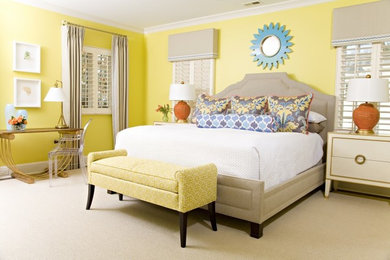Inspiration for a carpeted bedroom remodel in Charlotte with yellow walls