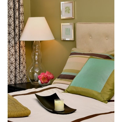 Example of a trendy bedroom design in Boston with green walls and no fireplace
