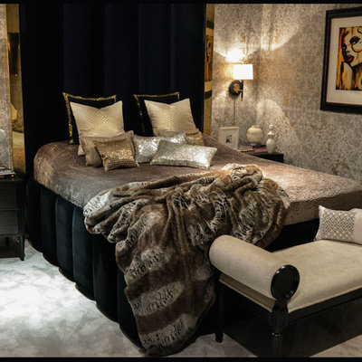 Example of a mid-sized trendy master carpeted bedroom design in Belfast with beige walls