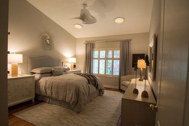 Photo of a medium sized contemporary master bedroom in Toronto with grey walls and light hardwood flooring.