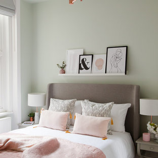 Traditional bedroom in London with carpet and grey floors.