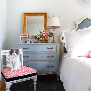 Shabby-chic style bedroom in DC Metro with white walls.