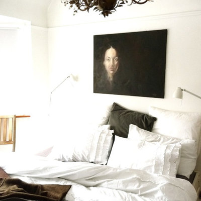 Example of an eclectic bedroom design in Other with white walls