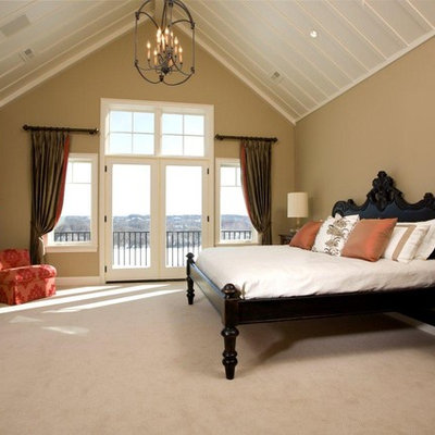 Elegant carpeted bedroom photo in Minneapolis with beige walls