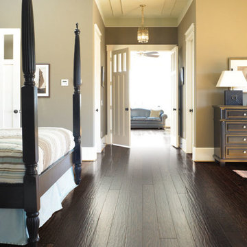 Bedroom with dark hardwood flooring