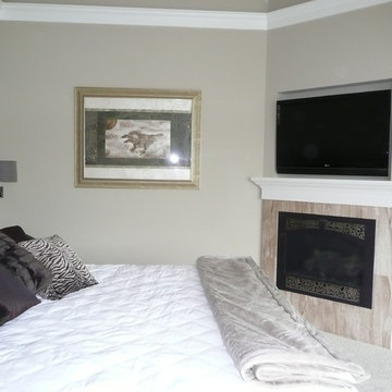 Bedroom with fireplace and TV