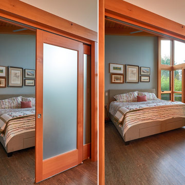 Bedroom with king bed; telescoping door provides privacy and barrier-free entry.