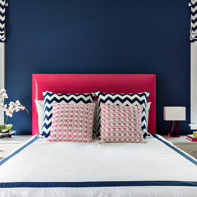 Trendy bedroom photo in New York with blue walls