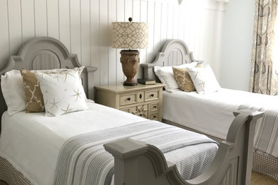 This is an example of a nautical bedroom in Atlanta with white walls and carpet.