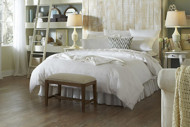 Inspiration for a mid-sized transitional master light wood floor bedroom remodel in Other with blue walls and no fireplace