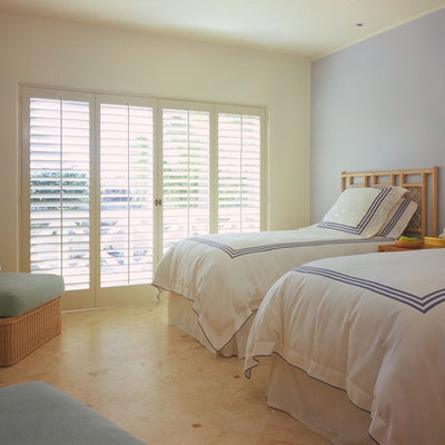Island style guest bedroom photo in Other with gray walls