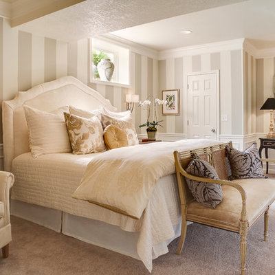 Large elegant master carpeted bedroom photo in Kansas City with multicolored walls
