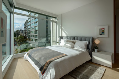Bedroom - contemporary light wood floor bedroom idea in Vancouver