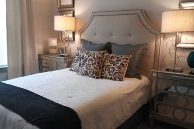 Example of a mid-sized transitional master brown floor bedroom design in Dallas with beige walls and no fireplace
