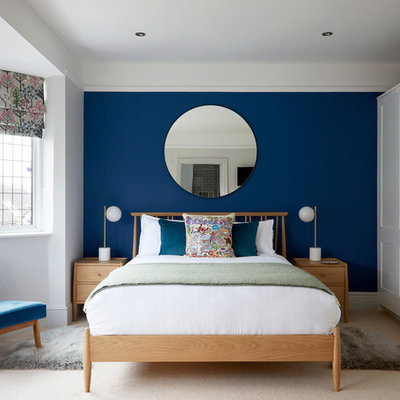 Inspiration for a transitional carpeted and beige floor bedroom remodel in Surrey with blue walls and no fireplace