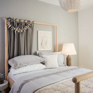 This is an example of a scandi guest bedroom in Manchester with grey walls.