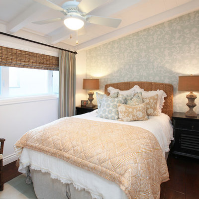 Bedroom - tropical dark wood floor bedroom idea in Orange County with white walls