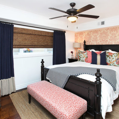 Island style dark wood floor bedroom photo in Orange County with white walls and no fireplace