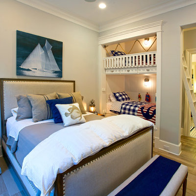 Bedroom - large coastal guest light wood floor and brown floor bedroom idea in Dallas with white walls and no fireplace