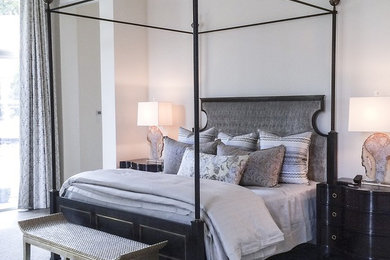 Inspiration for a large master bedroom remodel in Dallas with white walls
