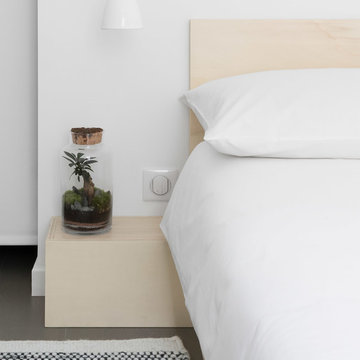 Bedside of a Minimal, Japanese Style White Bedroom