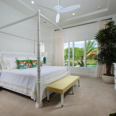 Beach style carpeted bedroom photo in Miami with white walls